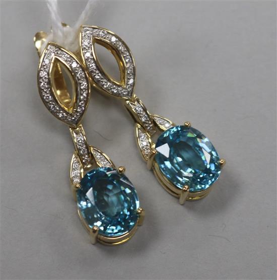 A pair of modern 18ct gold, blue zircon and diamond set drop earrings, 37mm.